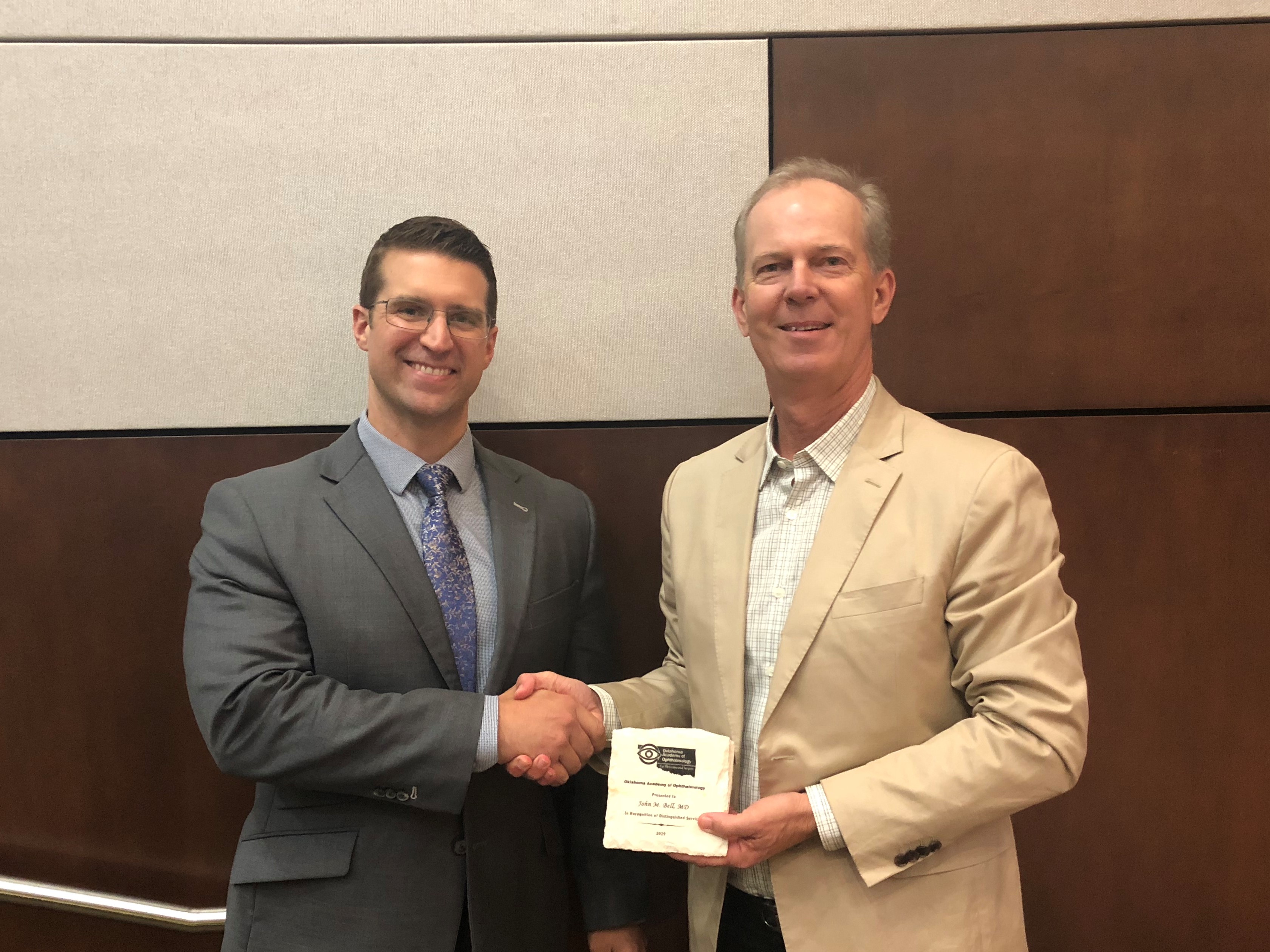 OAO President Ben Harvey, MD, Presenting the Award to John Bell, MD